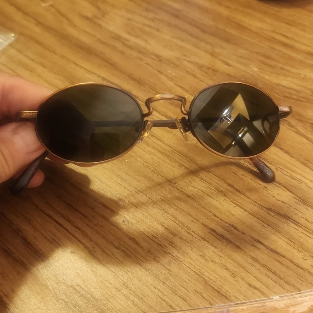 Revo Oval Copper Frame Sunglasses with Dark Gray Lenses